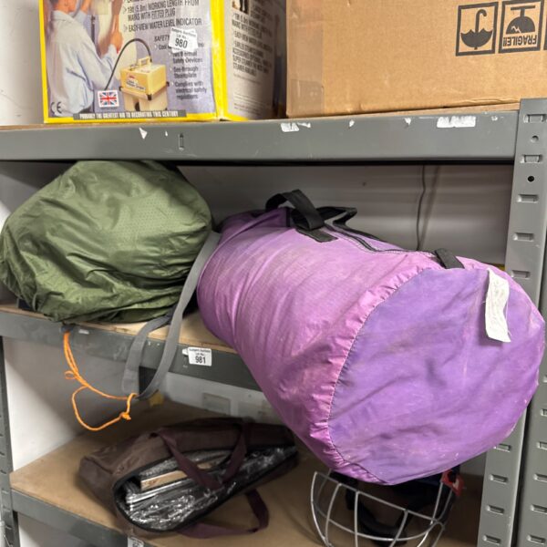 Two camping tents, a Khyam Traveller and a Peak 3, presented as found.