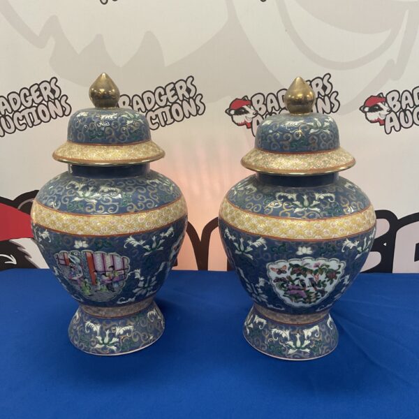 Pair of vibrant Chinese Canton ginger jars on display.