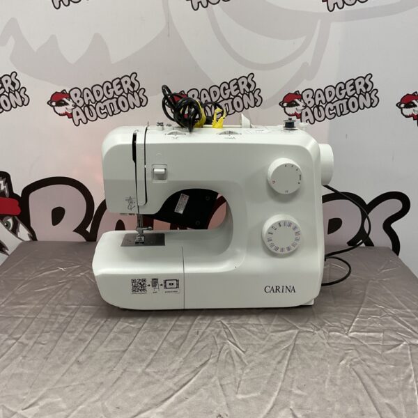 Vintage Carina sewing machine in used condition.