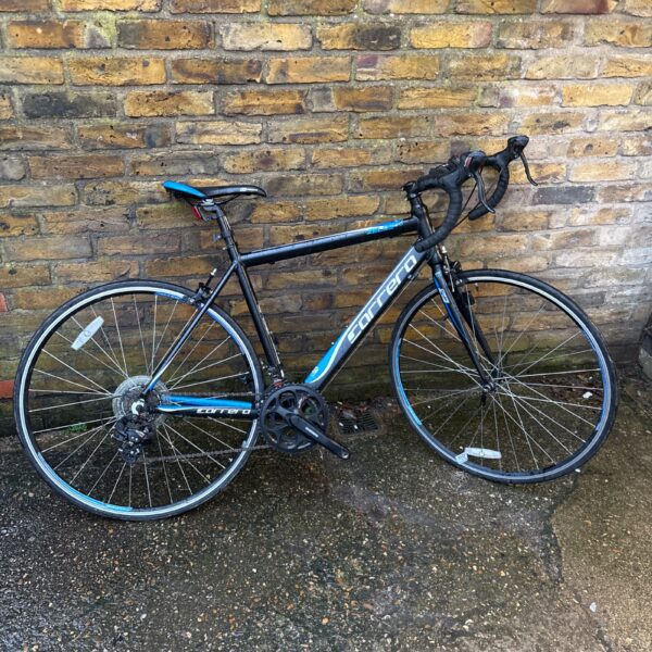 Side view of a black and green Carrera Zelos racing bike.