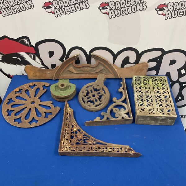 Antique cast iron brackets and trivet lot with Victorian detailing.