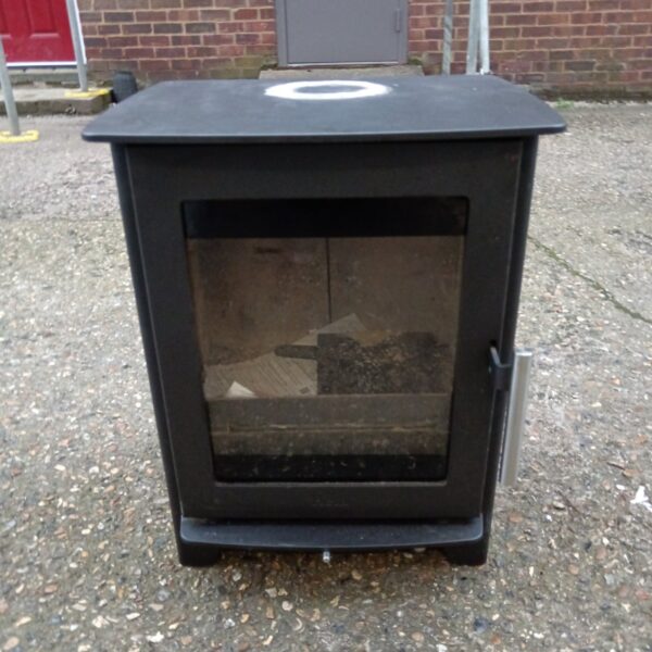 Vintage cast iron wood burning stove for home heating.
