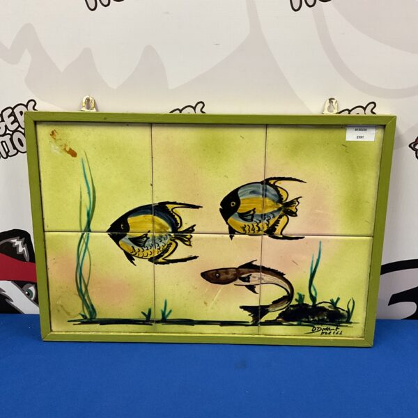 Hand painted ceramic fish tiles signed O D Mant, vibrant wall art.