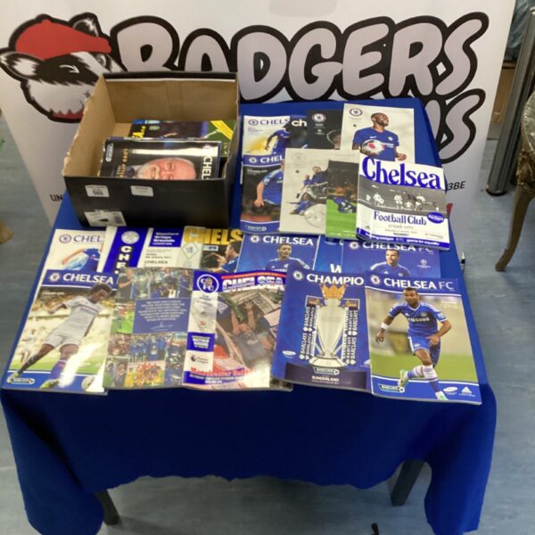 Box of modern Chelsea football programmes for collectors.