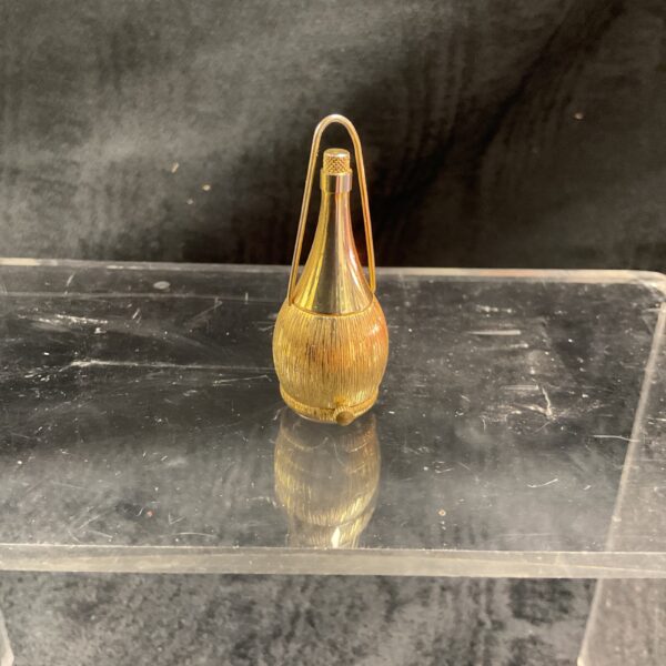 Gold tone Chianti bottle pendant watch on display.