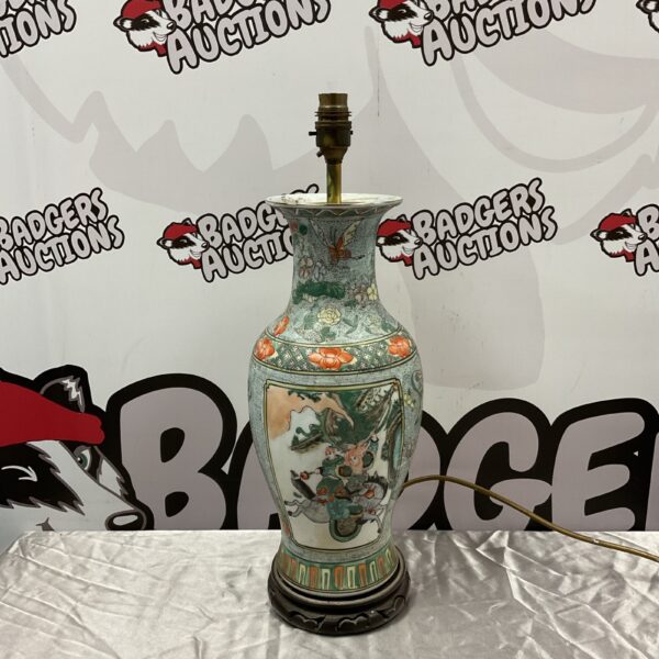 Hand-painted Chinese warrior vase table lamp with detailed porcelain design.