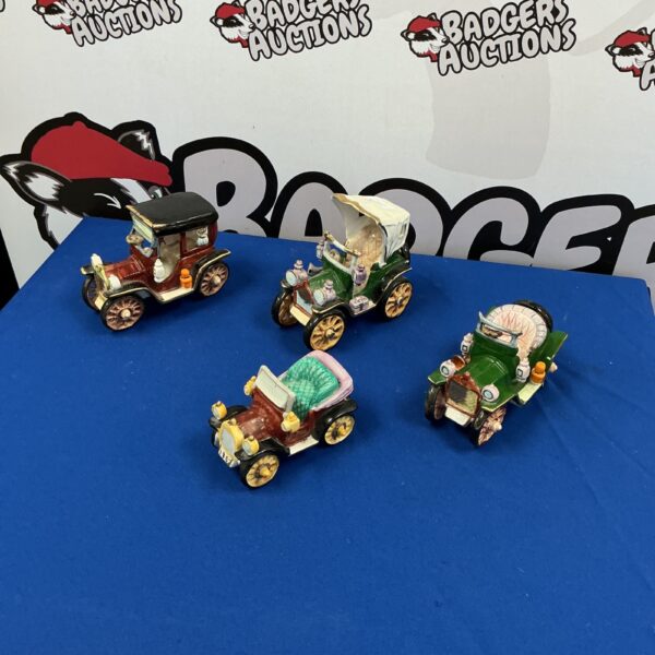 Set of four vintage Cl Assoc porcelain novelty cars.