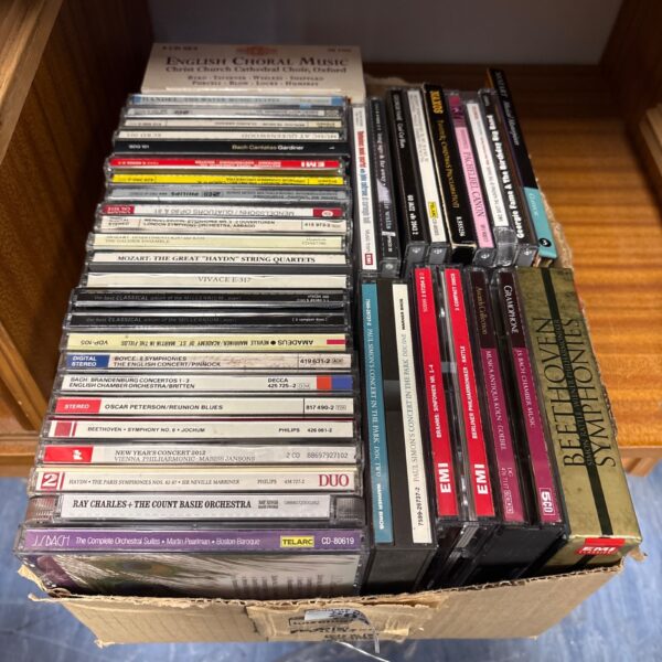 Lot of classical music CDs with various composers and orchestral works.