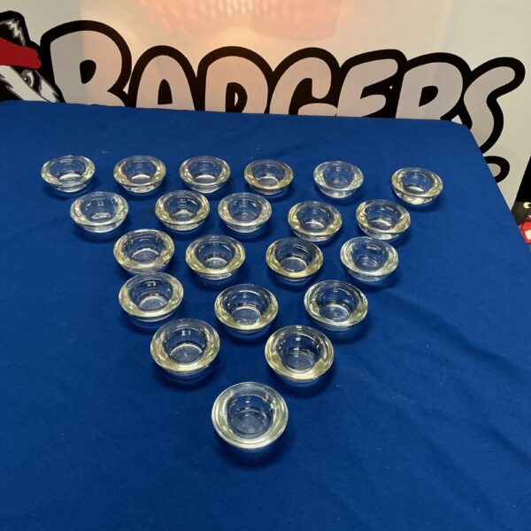 Clear glass tea light holders for warm ambient lighting.