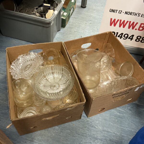 Large lot of clear glassware including decorative vases and pieces.