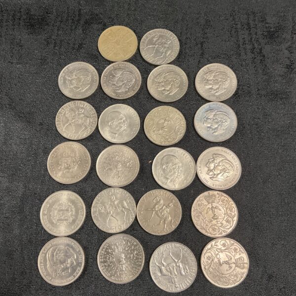 Collection of twenty-two British commemorative coins, including Churchill coins.