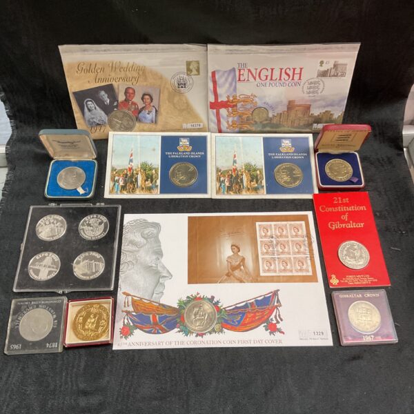 Collection of commemorative crown coins including Falkland Islands £5 coin.