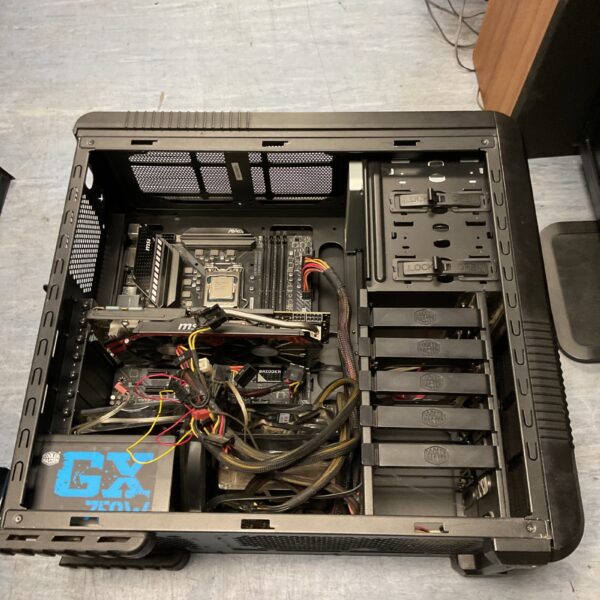 Computer case with motherboard, power supply, and graphics card inside.
