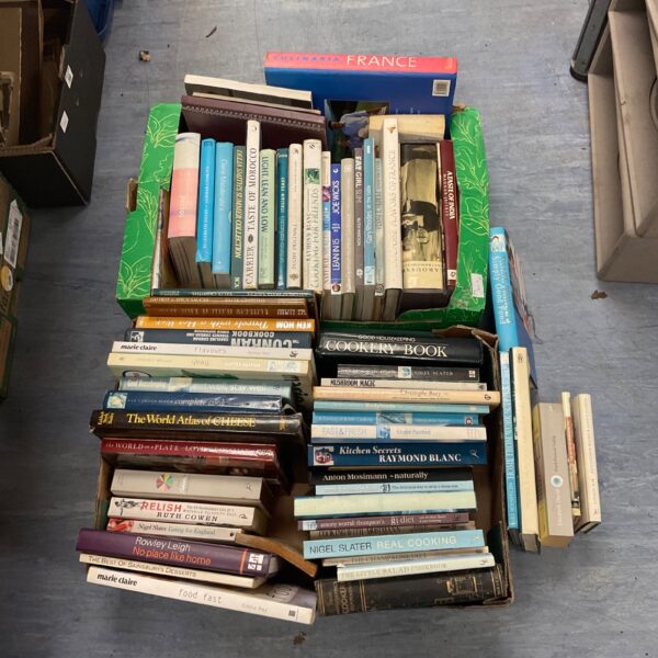 Large collection of vintage and modern cookery books for home cooking.