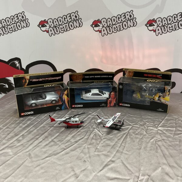 Corgi James Bond diecast model lot featuring BMW Z8, Lotus Esprit, and Gyrocopter.
