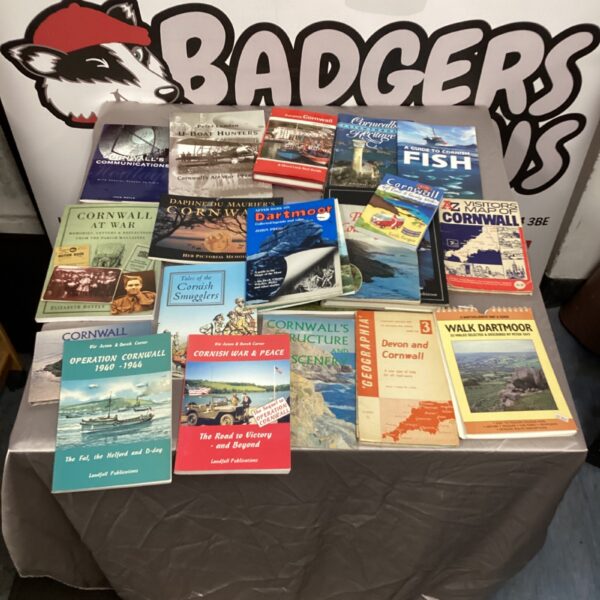 Vintage collection of Cornwall books, including maps and walking guides.