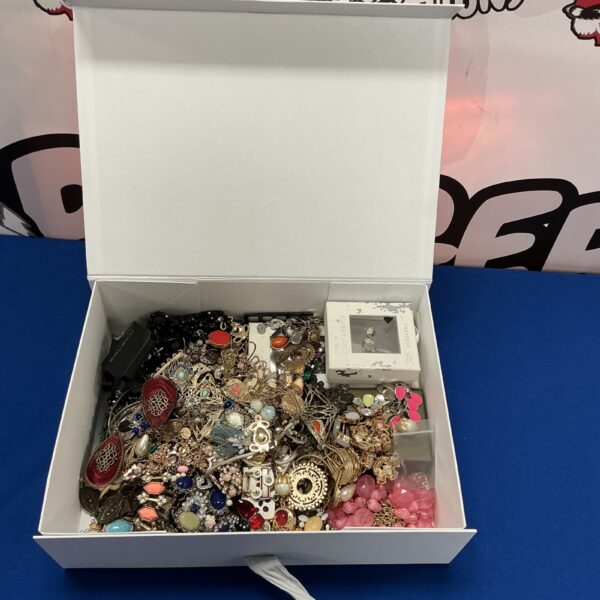 Colourful assortment of vintage and costume jewellery pieces.