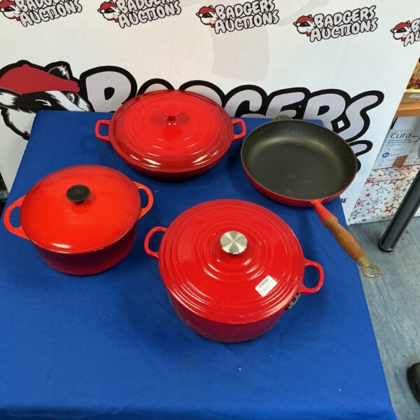 Red enamel Cousances cast iron cooking pot with lid.