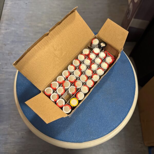 Box of CR123A lithium batteries for flashlights and cameras.