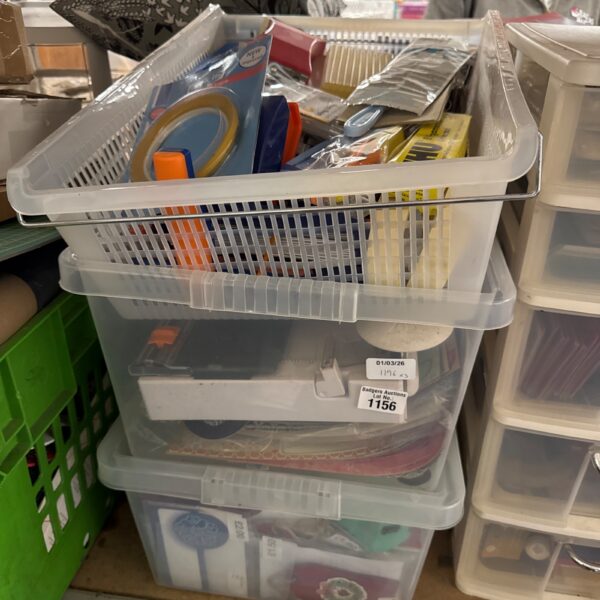 Clear plastic boxes filled with a mixed lot of crafting supplies.