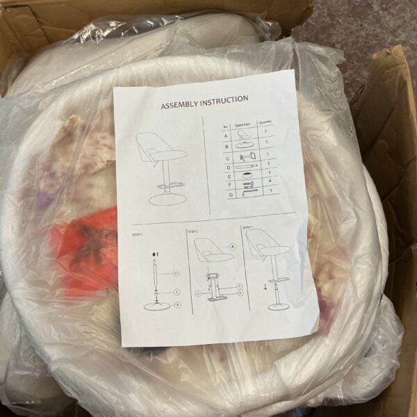Cream and black bar stools in original packaging, ready for assembly.
