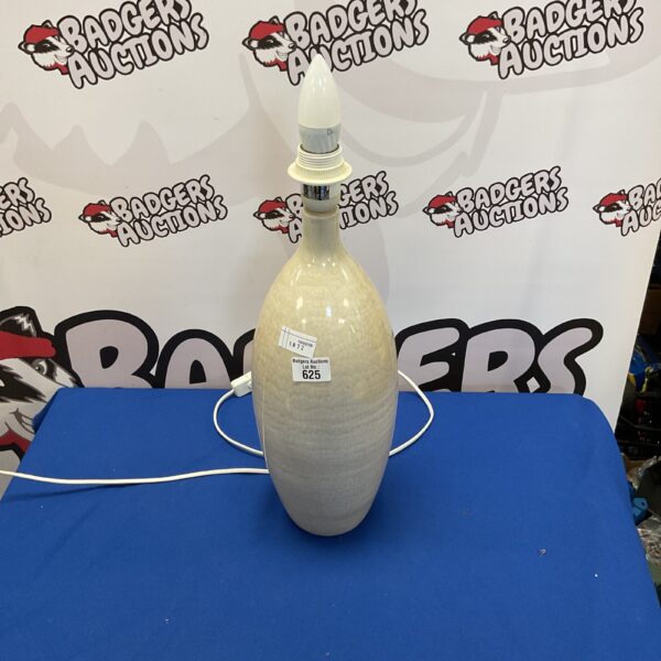 Cream ceramic table lamp for bedside or desk use.