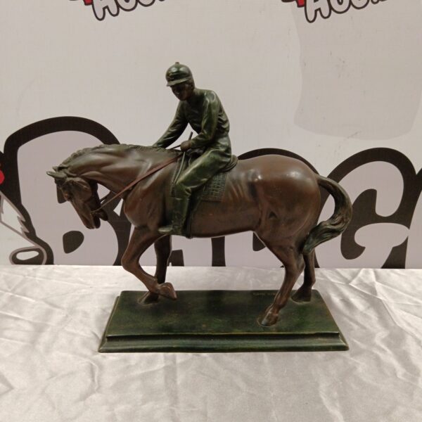 Detailed resin horse and jockey sculpture by Crosa, 1996.