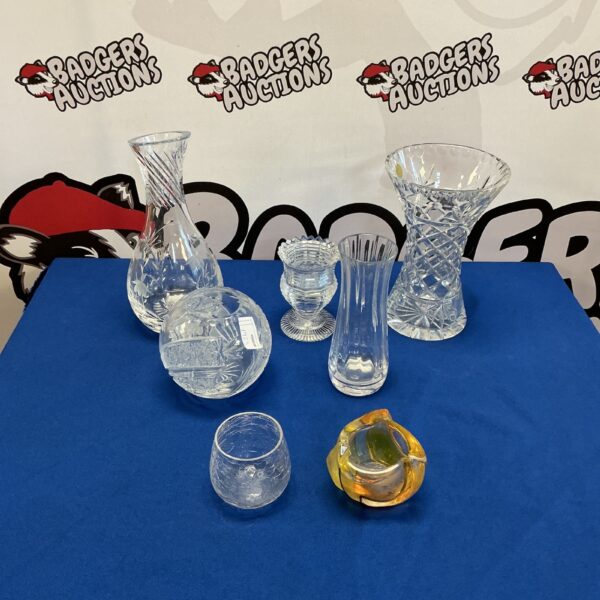 Selection of crystal vases with cut glass detailing.