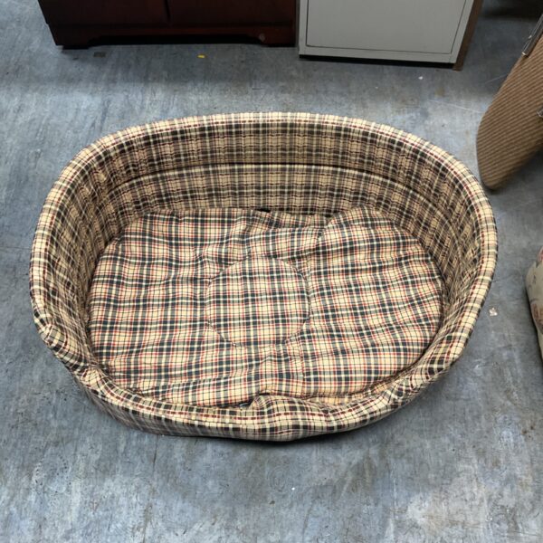 Vintage Danish dog bed with patterned fabric upholstery.