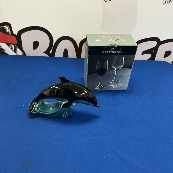 Darlington wine glasses with a decorative dolphin figurine.