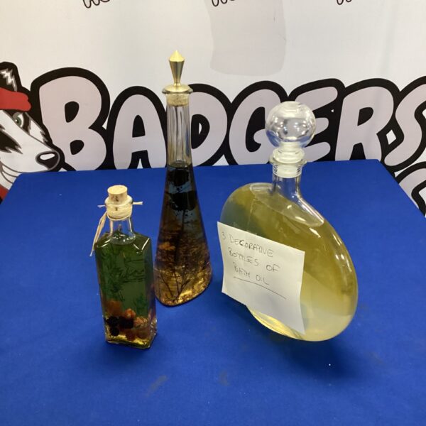 Vintage decorative bath oil bottles with colourful liquid.