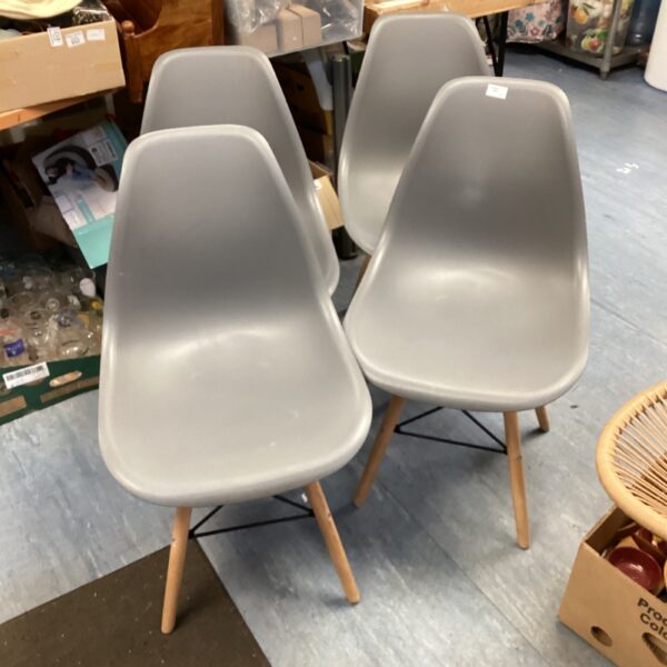 Stylish designer style chair with wooden legs.