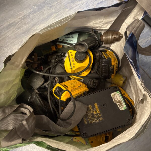 Dewalt and Bosch power tool lot with batteries and hammer drill.