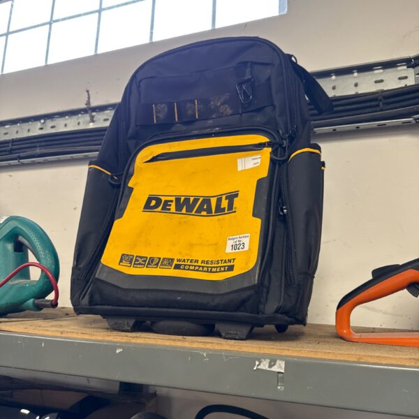 Front view of a durable Dewalt tool bag with multiple pockets.