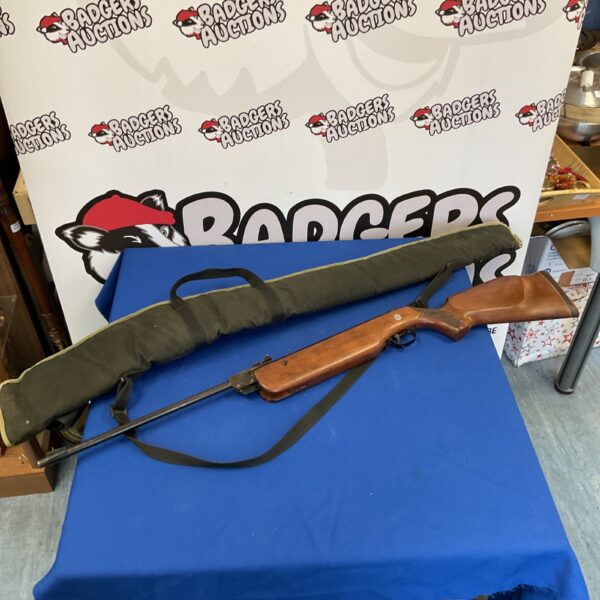 Vintage Diana Model 78 air rifle on a blue background.