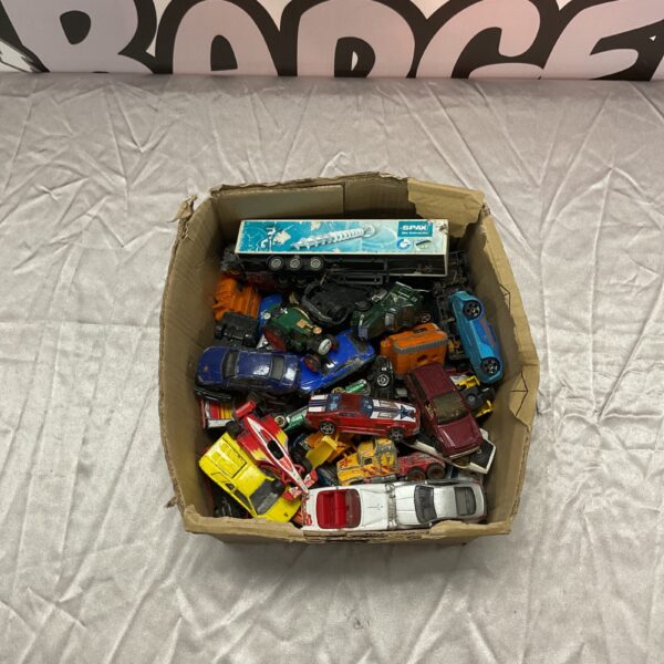 A box filled with a diverse lot of diecast model cars.