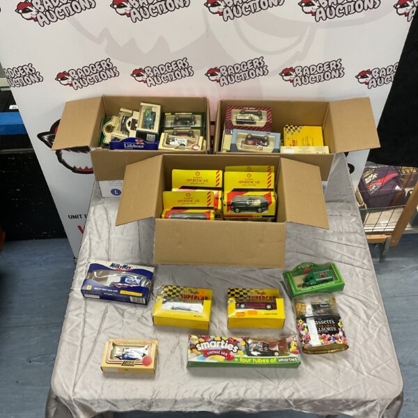 Diecast model car collection including Maisto and Lledo models.