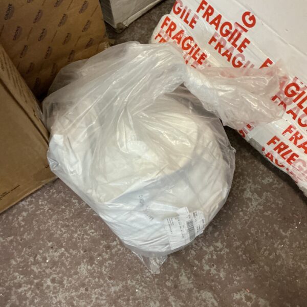 Unopened bags of dishwasher salt for appliance maintenance.