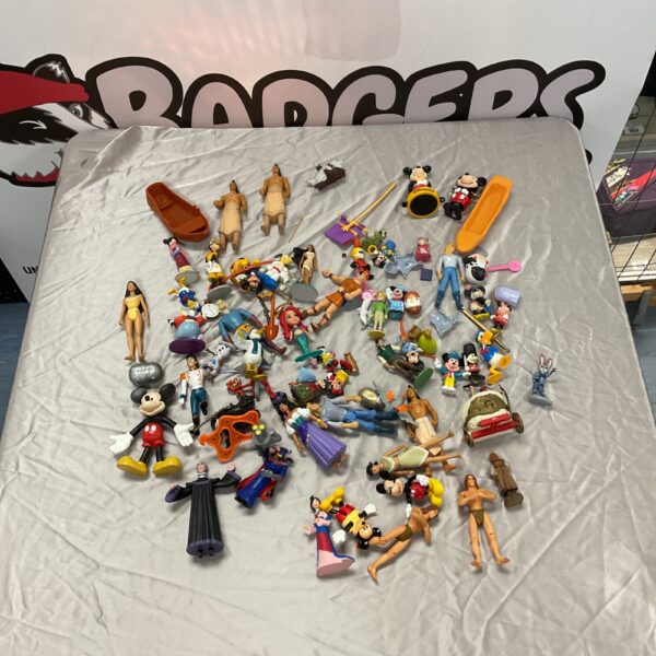 Vintage Disney figures collection featuring Mickey Mouse and friends.