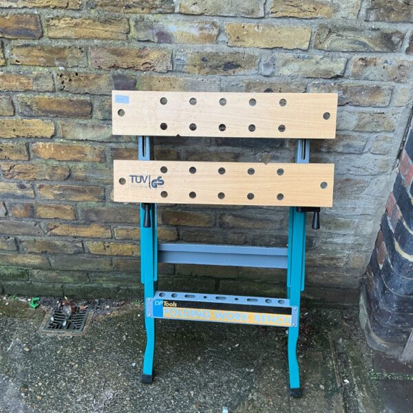 DP Tools folding workbench in a workshop setting.