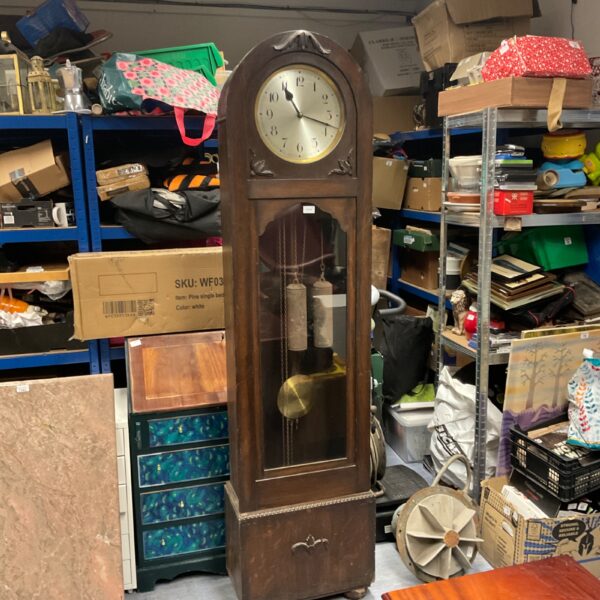 Antique oak dufa grandfather clock with weights and pendulum.