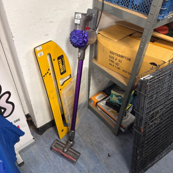 Purple Dyson V6 Animal cordless vacuum cleaner in used condition.
