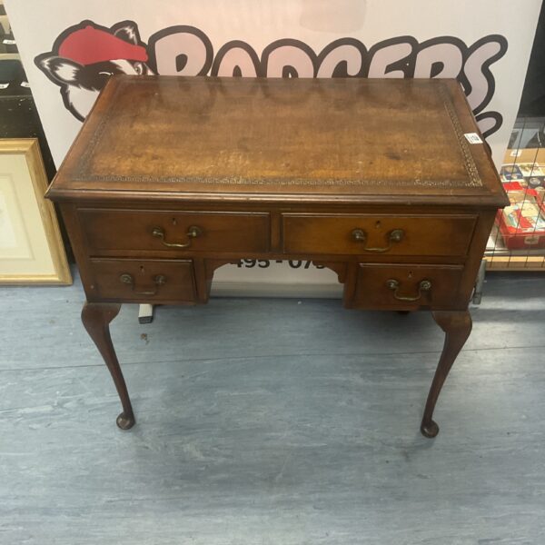 Antique Edwardian ladies desk with leather top and mahogany finish.