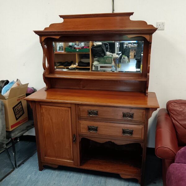 Antique Edwardian mahogany sideboard with mirror backing and cupboard storage.