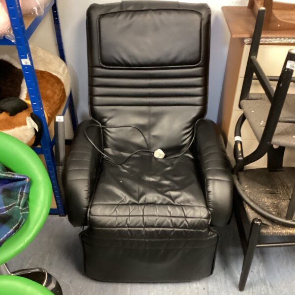 Dark electric reclining massage chair in used condition.
