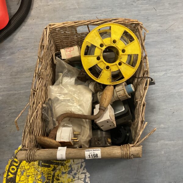 Basket of assorted electrical supplies and wiring.