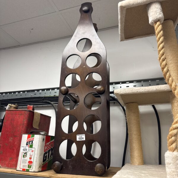 Vintage wooden eleven bottle wine rack for storage.