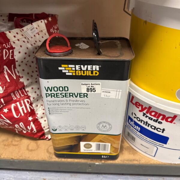 Half-full can of Everbuild wood preserver for timber protection.