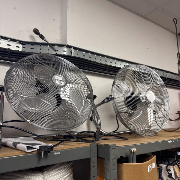 Vintage floor standing fans, including a Coldbreeze model.