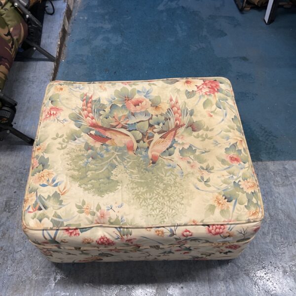 Vintage floral footstool with a bird pattern for home decor.